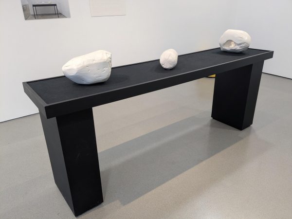 3 Black wooden exhibition tables